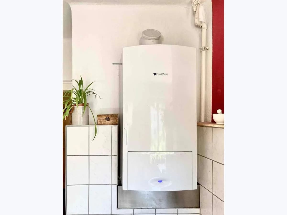 Wall-mounted combi gas boiler installed in a home